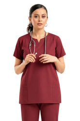 circular-neck scrub top with notched center and utility pockets close view
