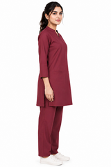 women’s piped V-neck scrub uniform in three-quarter side pose