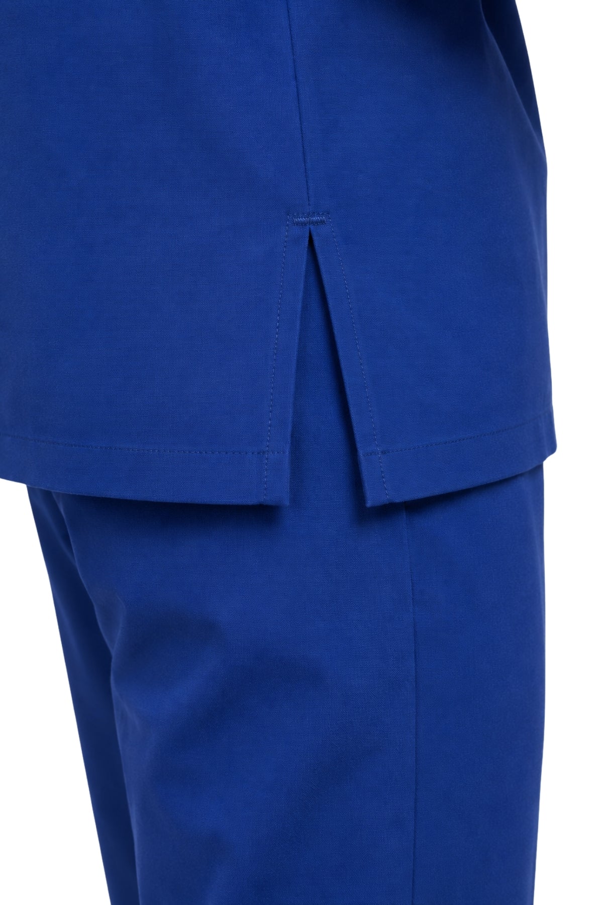 close-up of side slit and reinforced hem on men’s scrub top