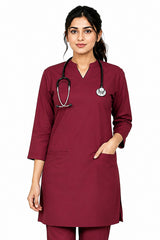 female doctor wearing a long-sleeve scrub top with utility pockets