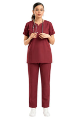 female healthcare professional in scrub uniform holding a stethoscope