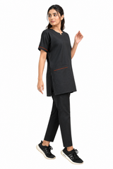 medical tunic and straight-leg scrub trousers shown in a side walking pose