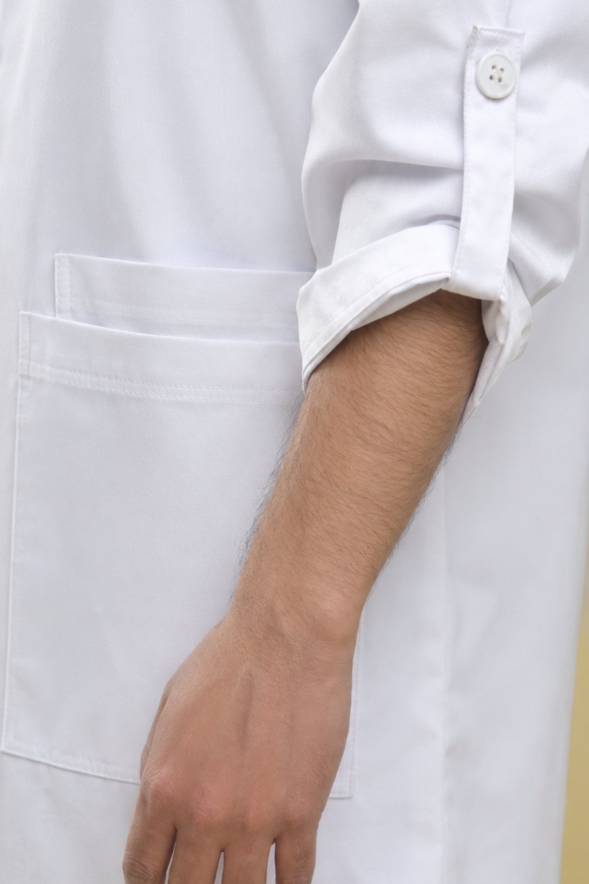 Clozzi white lab coat rolled open cuff button detail waist pocket close up Pakistan
